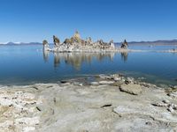 Scenic Mountain Landscape with Sandy Beach and Clear Sky
