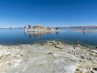 Scenic Mountain Landscape with Sandy Beach and Clear Sky