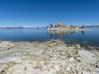 Scenic Mountain Landscape with Sandy Beach and Clear Sky