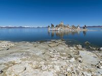 Scenic Mountain Landscape with Sandy Beach and Clear Sky