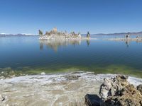 Scenic Mountain Landscape with Sandy Beach and Clear Sky