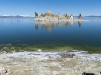 Scenic Mountain Landscape with Sandy Beach and Clear Sky