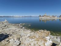 Scenic Mountain Landscape with Sandy Beach and Clear Sky