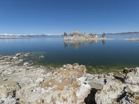 Scenic Mountain Landscape with Sandy Beach and Clear Sky