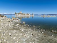 Scenic Mountain Landscape with Sandy Beach and Clear Sky