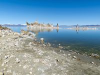 Scenic Mountain Landscape with Sandy Beach and Clear Sky