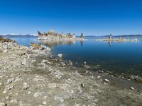 Scenic Mountain Landscape with Sandy Beach and Clear Sky