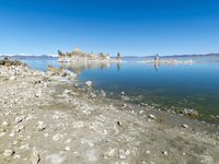 Scenic Mountain Landscape with Sandy Beach and Clear Sky