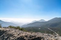 there is a view of a winding mountain road from a ridge on a clear day