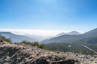 there is a view of a winding mountain road from a ridge on a clear day