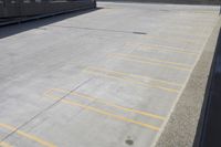 a parking lot with some stairs in front of it and a street light near by