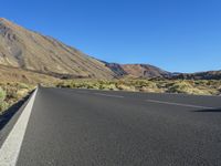 Scenic Road: Asphalt Meanders Through a Picturesque Rural Landscape