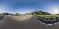 a 360 - view photo of a scenic road that ends at the end of a hill