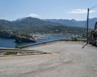 there is a mountain view as if looking down on a road with mountains in the back ground