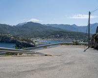 there is a mountain view as if looking down on a road with mountains in the back ground