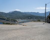 there is a mountain view as if looking down on a road with mountains in the back ground