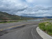 Scenic Road in Colorado: A Landscape Leading to a Lake