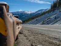 Scenic Road in Colorado: Snow-Covered Trees and Majestic Mountains