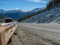 Scenic Road in Colorado: Snow-Covered Trees and Majestic Mountains