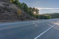 Scenic Road at Dawn with Trees and Hills