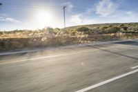 Scenic Road Through Grassy Plains with African Sky