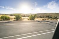 Scenic Road through Grassy Plains under African Sky