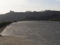 Scenic Road through Highlands with Loch and Mountains