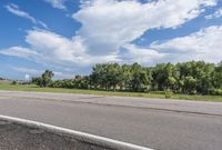 Scenic Road with Lush Landscape and Clear Sky