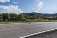 Scenic Road with Lush Landscape and Clear Sky