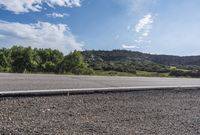 Scenic Road with Lush Landscape and Clear Sky