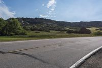 Scenic Road with Lush Landscape and Clear Sky