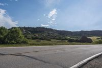 Scenic Road with Lush Landscape and Clear Sky