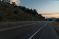 Scenic Road Through Mountain Landscape at Dawn