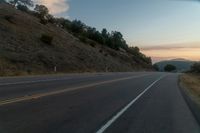 Scenic Road Through Mountain Landscape at Dawn