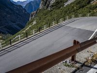 a road windscreens in the distance with a mountainous background and trees below it