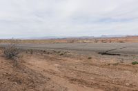 the road stretches along the dry desert area for vehicles to travel through the valley on