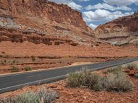 A Scenic Road in the USA: Clear Skies and Fluffy Clouds