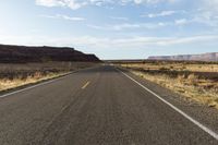 the road is empty and empty in the desert land, and it looks empty from the perspective