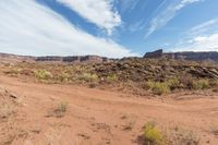 Scenic road in Utah desert with red rock mountains