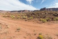 Scenic road in Utah desert with red rock mountains