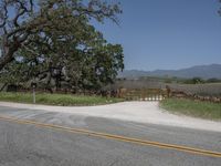 this is an image of the entrance to a ranch gate on the side of the road