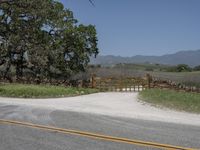 this is an image of the entrance to a ranch gate on the side of the road