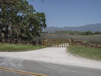 this is an image of the entrance to a ranch gate on the side of the road