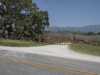 this is an image of the entrance to a ranch gate on the side of the road