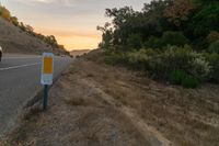 an empty road with a sign in front of it that reads get on the highway