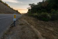 an empty road with a sign in front of it that reads get on the highway