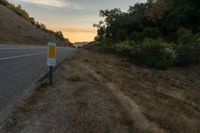 an empty road with a sign in front of it that reads get on the highway