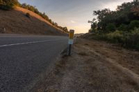 an empty road with a sign in front of it that reads get on the highway