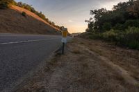 an empty road with a sign in front of it that reads get on the highway