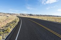 Scenic Utah: Asphalt Road Through Mountainous Desert